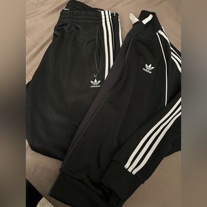 Black and grey adidas track suit top and bottom